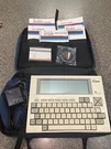 Tandy Nec -8300 Laptop Computer, New, Never Used, Books, Tape, Charger. Fixed Price $950.00.